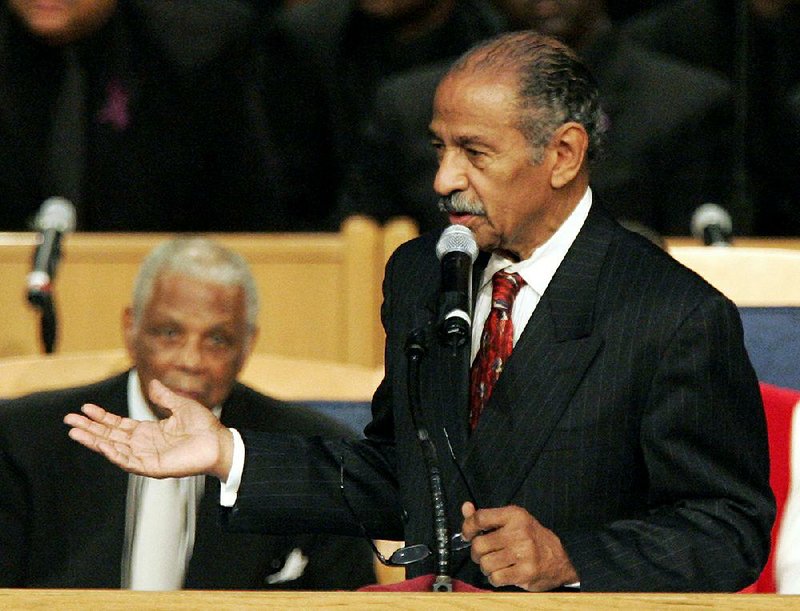 Former Rep. John Conyers, shown in 2005 at the funeral of civil-rights pioneer Rosa Parks, became one of only six black House members when he first won his seat in 1964. 