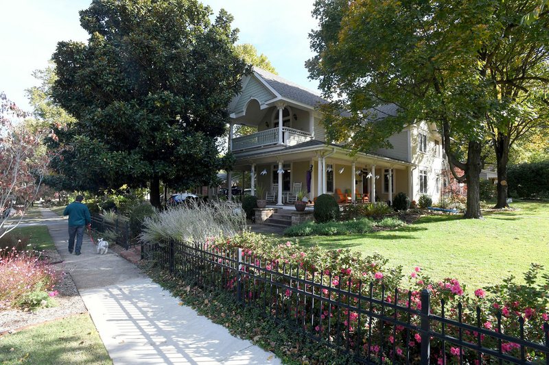 NWA Democrat-Gazette/J.T.WAMPLER The Norman house, a Queen Anne-influenced style home constructed in 1880 with a large wrap-around porch is seen Wednesday at 502 N. Washington Ave. in Fayetteville. The city's Historic District Commission has prepared a petition for neighbors to sign that would establish the Washington-Willow neighborhood as a local historic preservation district.