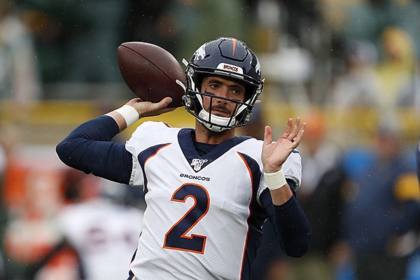Denver Broncos quarterback Brandon Allen warms up before the start of an NFL football game between the Denver Broncos and Green Bay Packers Sunday, Sept. 22, 2019, in Green Bay, Wis. (AP Photo/Matt Ludtke)