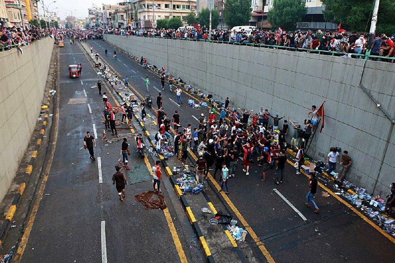 Anti-government protesters gather Monday near Tahrir Square in Baghdad.