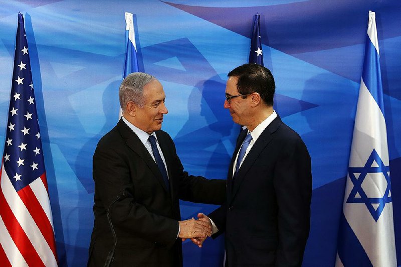 Israeli Prime Minister Benjamin Netanyahu (left) and U.S. Treasury Secretary Steven Mnuchin meet Monday at a joint news conference in Jerusalem.