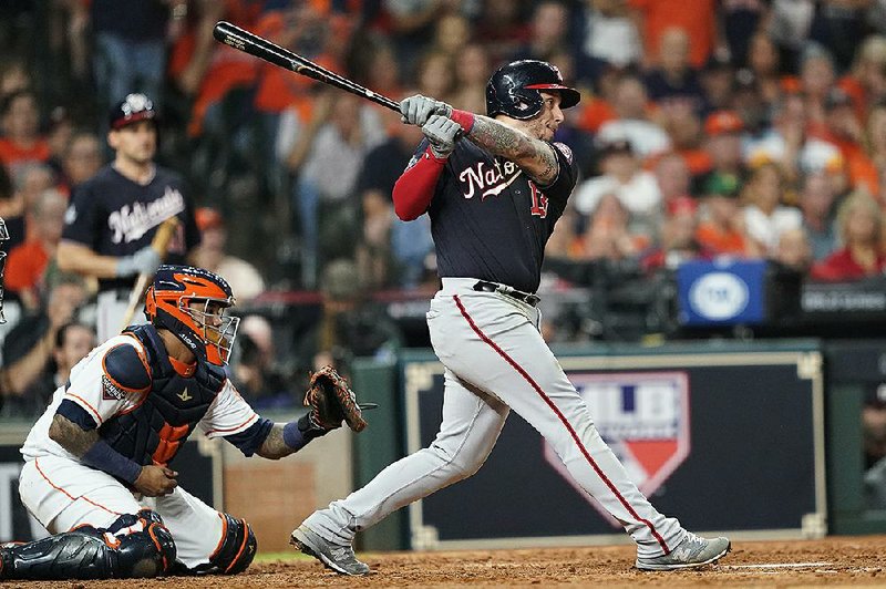 Washington’s Asdrubal Cabrera hits a two-run single during a six-run seventh inning for the Nationals in Game 2 in Houston. The Nationals romped 12-3, winning in Houston for the second consecutive night.