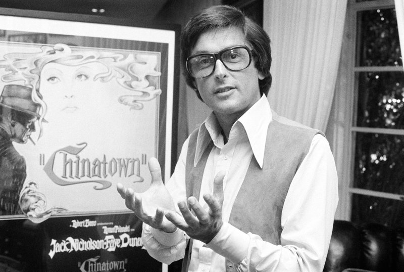 CLARIFIES ROLE AS FILM EXECUTIVE - FILE - This 1974 file photo shows Paramount Pictures production chief Robert Evans talking about his film &quot;Chinatown&quot; in his office in Beverly Hills, Calif. A representative for Evans, the producer of &#x201c;Chinatown&#x201d; who helped shepherd films including &#x201c;The Godfather&#x201d; and &#x201c;Harold and Maude&#x201d; to the screen as chief of Paramount Pictures, confirmed that Evans passed away Saturday, Oct. 26, 2019. He was 89. No other details were immediately available. (AP Photo/Jeff Robbins, File)