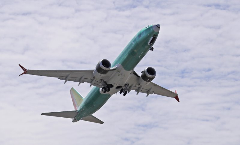 FILE - In this May 8, 2019, file photo, a Boeing 737 MAX 8 jetliner being built for Turkish Airlines takes off on a test flight in Renton, Wash. On the anniversary of the first crash of a Boeing 737 Max, the CEO will begin two days of testimony before Congress by telling lawmakers that the aircraft company knows it made mistakes and is throwing everything into fixing the plane. (AP Photo/Ted S. Warren, File)