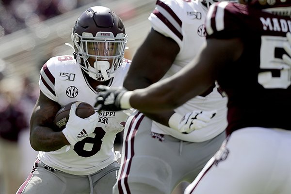 Mississippi State running back Kylin Hill (8) looks to run behind his offensive line against Texas A&M during the second half of an NCAA college football game, Saturday, Oct. 26, 2019, in College Station, Texas. (AP Photo/Sam Craft)