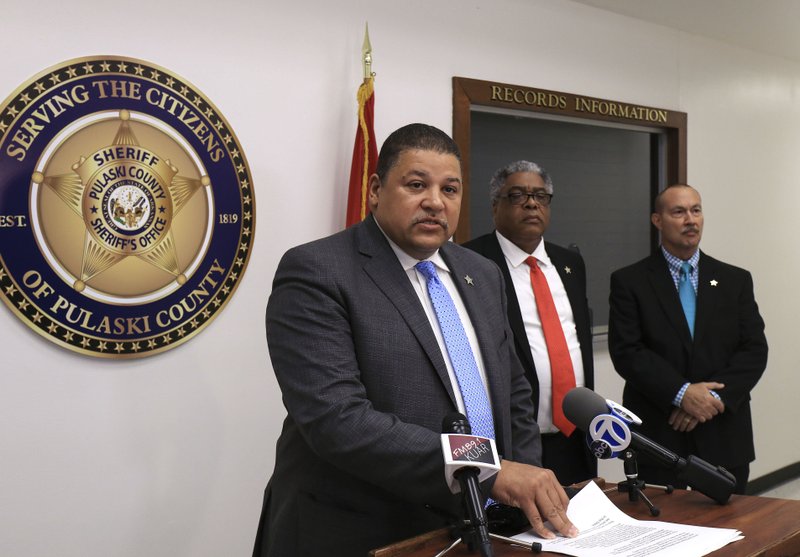 Pulaski County Sheriff Eric Higgins on Monday announces plans to purchase body cameras for county deputies and jail staff, which both Enforcement Chief Deputy Earnest Whitten (center) and Detention Chief Deputy Charles Hendricks welcomed.