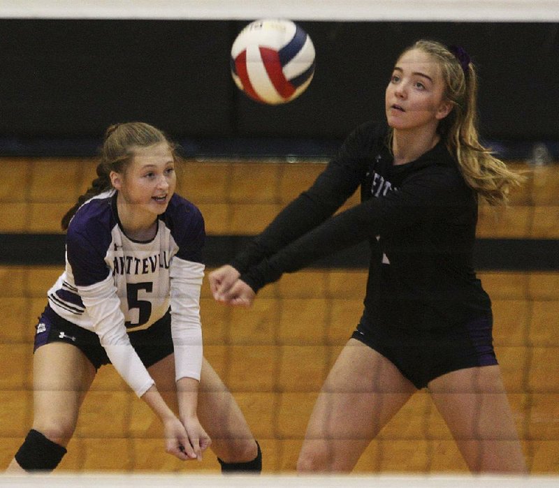 Fayetteville’s Gracyn Spresser (right) hits the ball Tuesday in front of teammate Sadie Thompson during the Lady Bulldogs’ 25-18, 25-9, 25-8 victory over Mount St. Mary in the Class 6A state volleyball tournament in Cabot. More photos are available at arkansasonline.com/1030volleyball6A/. 