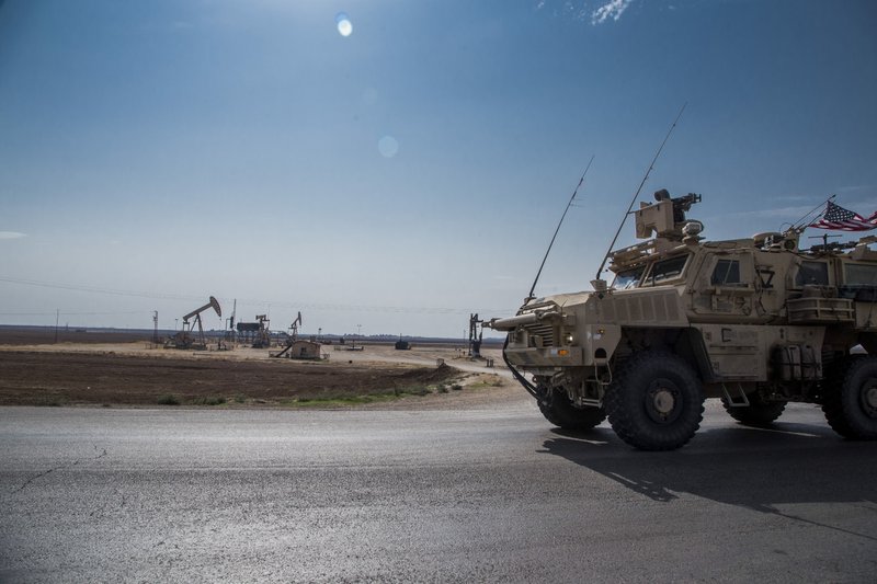 In this Monday, Oct. 28, 2019 photo, U.S. forces patrol Syrian oil fields. Pentagon is increasing U.S. efforts to protect Syria's oil fields from the extremist group as well as from Syria itself and the country's Russian allies. (AP Photo/Baderkhan Ahmad)