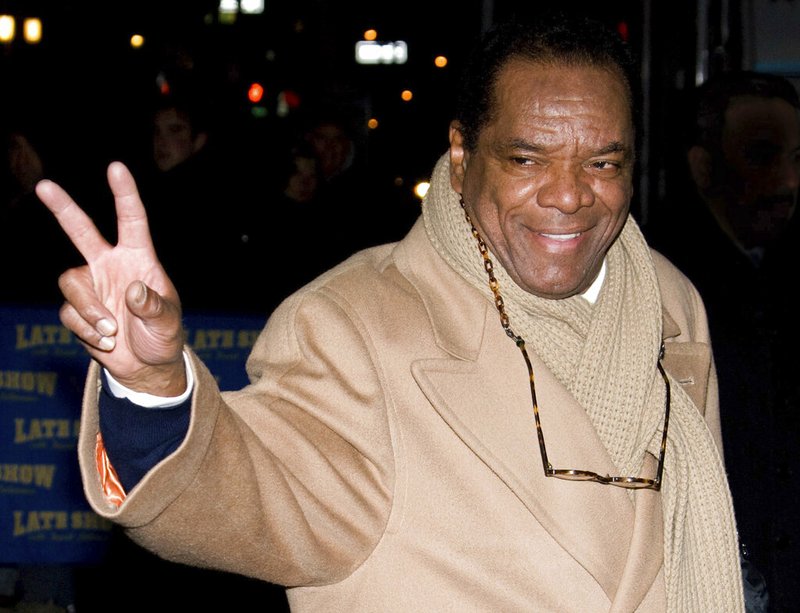 In this Dec. 21, 2009, file photo, John Witherspoon leaves a taping of "The Late Show with David Letterman" in New York. Actor-comedian Witherspoon, who memorably played Ice Cube's father in the "Friday" films, has died at age 77. Witherspoon's manager Alex Goodman confirmed late Tuesday, Oct. 29, 2019, that Witherspoon died in Los Angeles. (AP Photo/Charles Sykes, File)