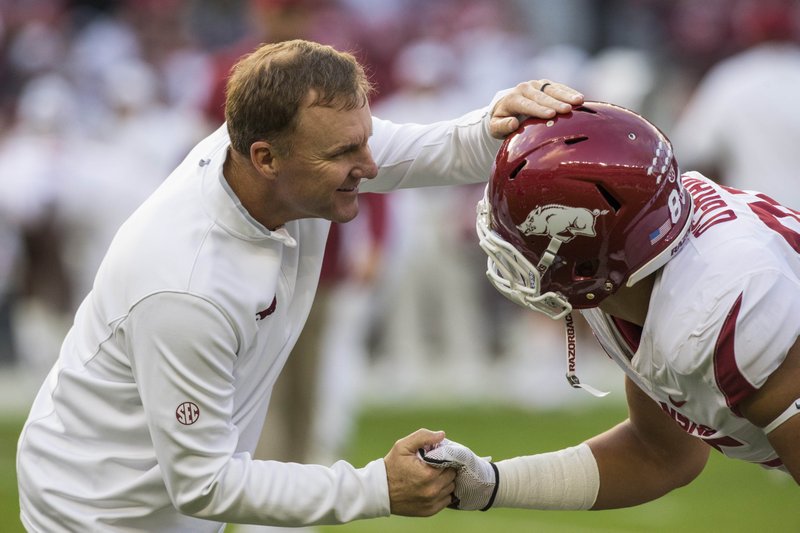 Chad Morris, Arkansas head coach, greets Cheyenne O'Grady, Arkansas tight end, during warmups before the game vs Alabama Saturday, Oct. 26, 2019, at Bryant-Denny Stadium in Tuscaloosa, Ala.