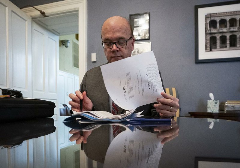 House Rules Committee Chairman Jim McGovern of Massachusetts works Wednesday on the resolution formally setting the next steps in an impeachment proceeding that the House is expected to vote on today. The resolution would allow public hearings. More photos at arkansasonline.com/1031impeach/ 
