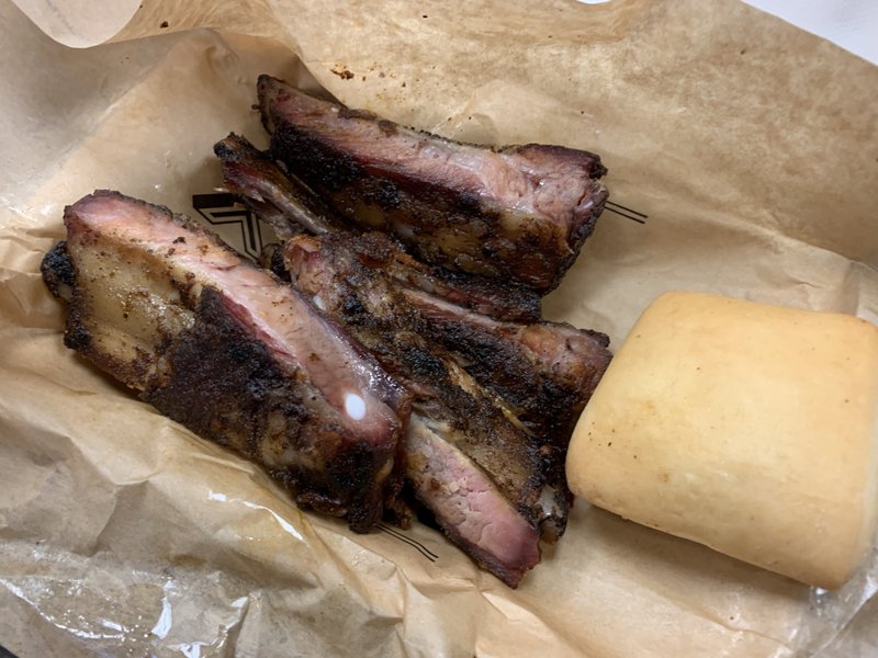 Six pork ribs, with a roll and two sides, make up the Pork Rib Plate at the Dickey's Barbecue Pit on North Rodney Parham Road. Arkansas Democrat-Gazette/Eric E. Harrison

