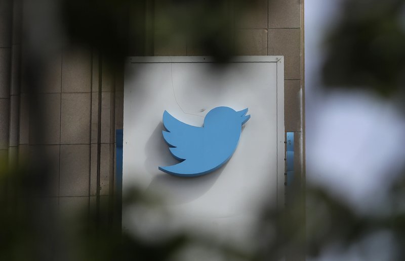 FILE - This July 9, 2019, file photo shows a sign outside of the Twitter office building in San Francisco. Twitter is banning all political advertising from its service, saying social media companies give advertisers an unfair advantage in proliferating highly targeted, misleading messages. (AP Photo/Jeff Chiu, File)