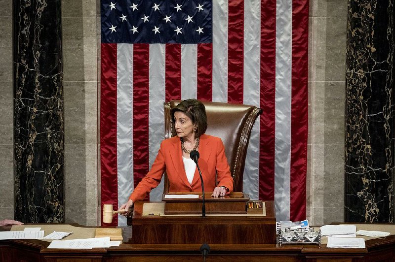 House Speaker Nancy Pelosi sounds the gavel Thursday after the House approved the resolution on its impeachment inquiry process. Before the vote, Pelosi called the inquiry effort “solemn” and “prayerful,” and “not cause for any glee or comfort.” More photos at arkansasonline.com/111impeach/ 