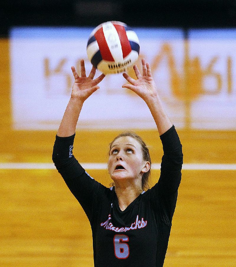 Fort Smith Southside’s Hannah Hogue (above) sets the ball Thursday during the Mavericks’ 3-1 victory over Springdale Har-Ber in the semifinals of the Class 6A state volleyball tournament in Cabot. For more photos, see arkansasonline.com/111volleyball/. 