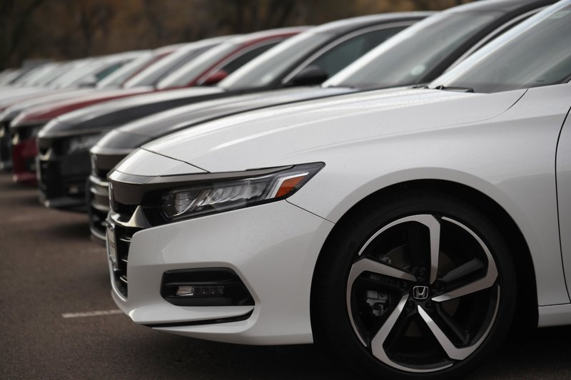 In this Oct. 20, 2019, file photo a long row of unsold 2020 Accord sedans sits at Honda dealership in Littleton, Colo. On Thursday, Oct. 31, the Commerce Department issued its September report on consumer spending, which accounts for roughly 70 percent of U.S. economic activity. (AP Photo/David Zalubowski, File)