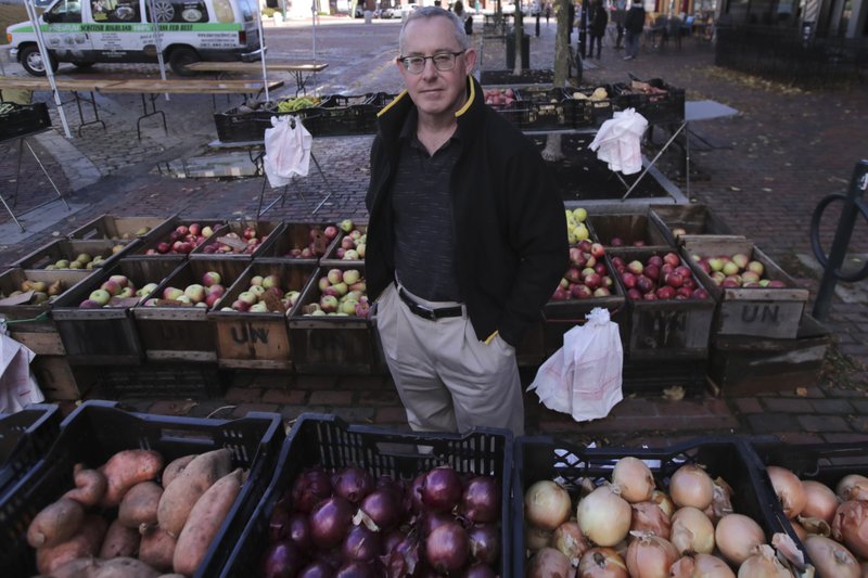 John Gold, self-employed graphics designer, poses at a farmer's market outside his office in Portland, Maine, on Wednesday. Gold has been covered by the Affordable Care Act since it started, plans on shopping for plans for 2020 again when the enrollment season starts Nov. 1. The 2020 sign-up season for the Affordable Care Act is getting underway today with premiums down slightly in many states and more health plan choices for consumers. - AP Photo/Charles Krupa