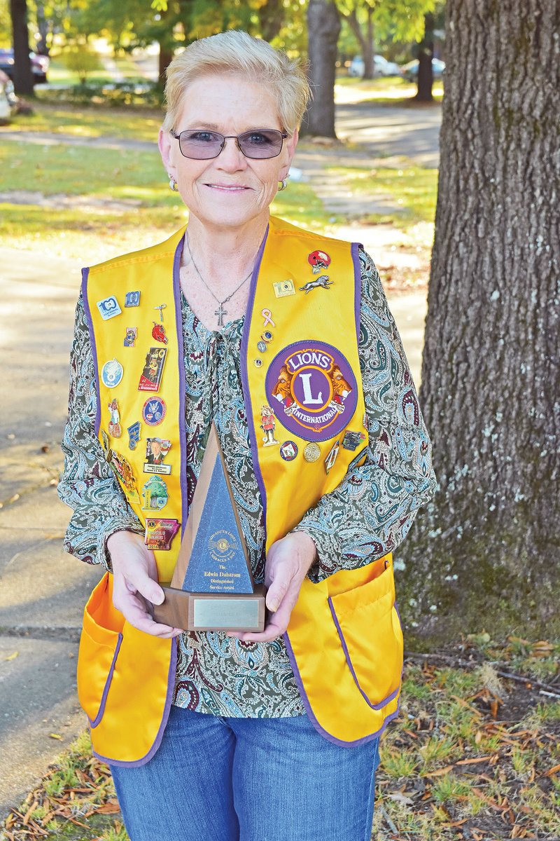 Terri Duran, a member of the Jacksonville Lions Club, holds the Dalstrom Award she received from the club through the Mid-South Lions Sight and Hearing Service in Memphis, Tenn. The distinguished service award is named for the organization’s first president, Edwin Dalstrom. Bob Williams, secretary of the Jacksonville Lions Club, said Duran is “an exceptional member.”