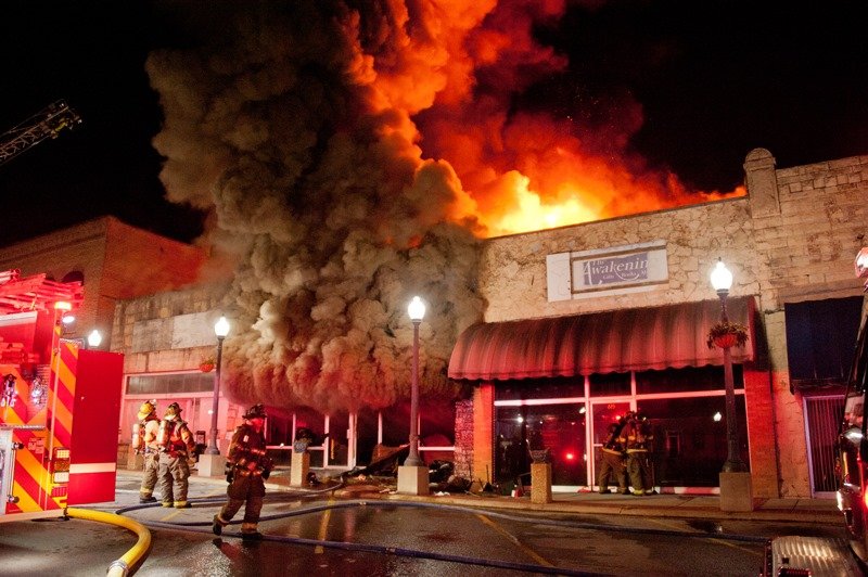 Firefighters battle a blaze inside the Olde Thyme Restaurant on the Square in Mountain Home.