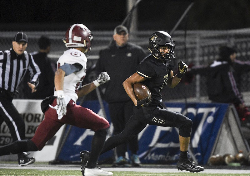 NWA Democrat-Gazette/CHARLIE KAIJO Bentonville wide receiver Chaz Nimrod (5) carries the ball Friday, November 1, 2019 during a football game at Bentonville High School in Bentonville.