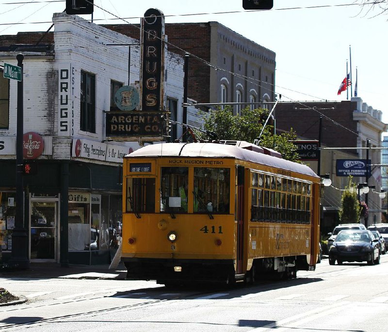 The River Rail Trolley makes its way along Main Street in down- town North Little Rock on Saturday. Trolley ridership has tripled in the city since last year, the mayor says. 