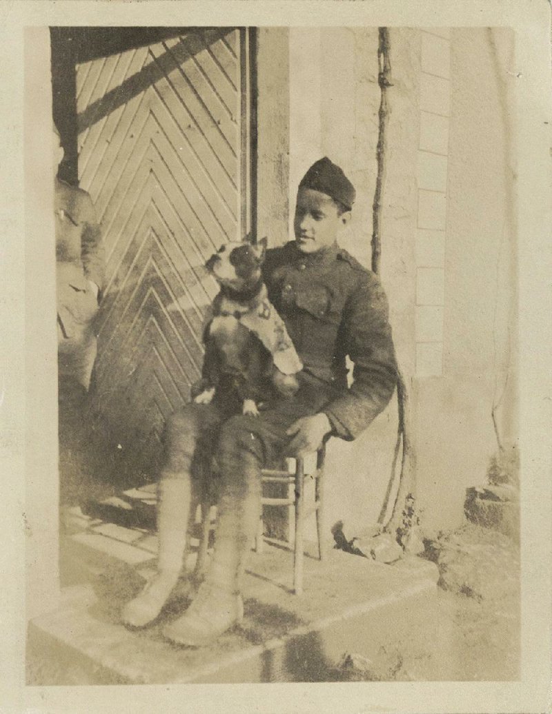 Famed war dog Stubby sits in the lap of Cpl. J. Robert Conroy while deployed to Europe during World War I. 