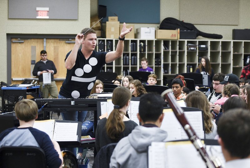 NWA Democrat-Gazette/CHARLIE KAIJO Dylan Gilliland, the eighth-grade band teacher, leads Thursday at his band class at Fulbright Junior High School in Bentonville. His band has 95 members. Official Oct. 1 enrollment figures are out for Arkansas school district for this school year. Bentonville led the way in terms of growth with a 3.6% increase. Rogers, Fayetteville and Springdale saw more modest increases. Fulbright's enrollment is larger than ever with more than 1,000 students. story.lead_photo.caption