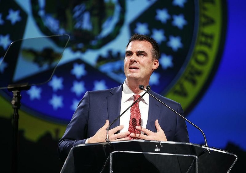 Oklahoma Gov. Kevin Stitt said his state is “implementing the will of the people” by commuting the sentences of 527 prisoners. More photos are available at arkansasonline.com/114commuted/ 