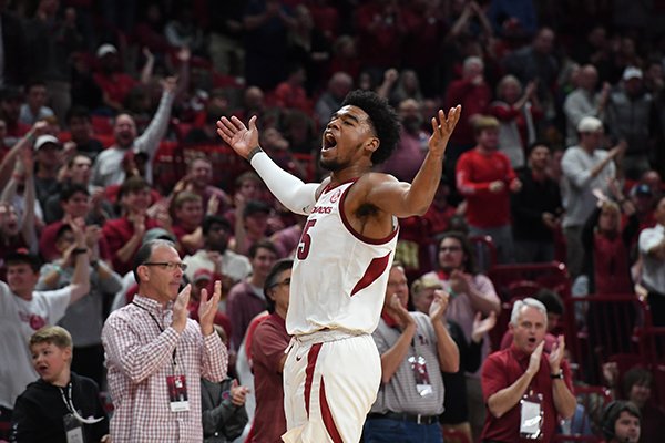 Arkansas guard Mason Jones (15) celebrates during a game against Rice on Tuesday, Nov. 5, 2019, in Fayetteville.