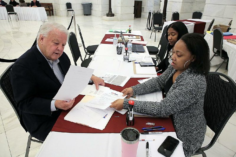 Larry Wallace files paperwork Tuesday at the state Capitol to place former Vice President Joe Biden’s name on the ballot for president in Arkansas’ March 3 primary. 