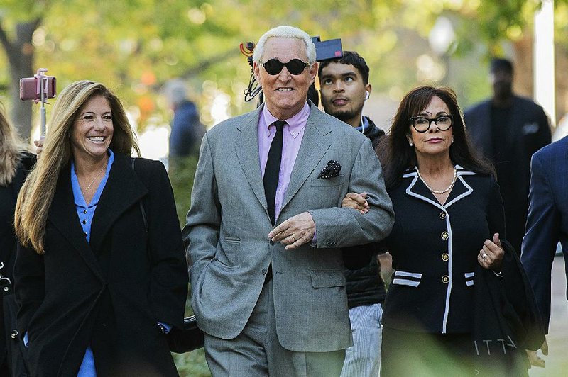 Roger Stone and his wife, Nydia (right), arrive for court Tuesday in Washington.