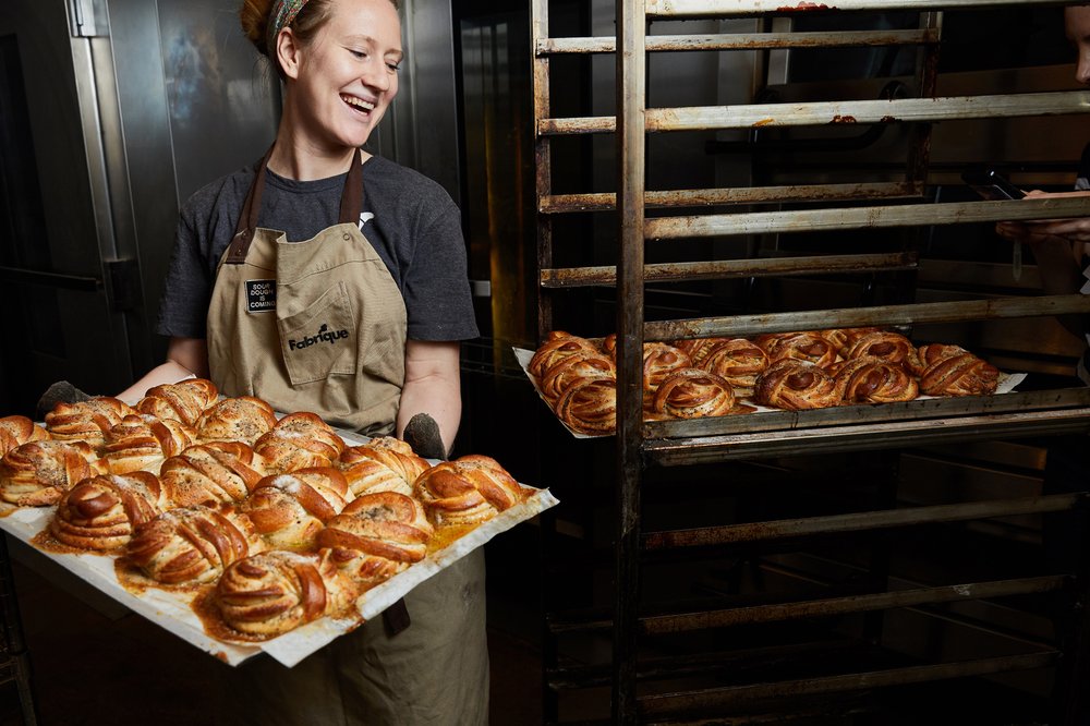 Johanna Svensson, head baker at the Swedish bakery Fabrique, with trays of kardemummabulle, or cardamom buns, in New York.
Photo by Colin Clark (The New York Times)