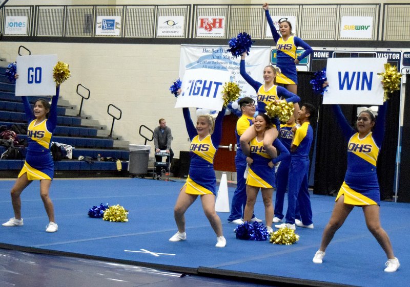 Westside Eagle Observer/MIKE ECKELS The Decatur High School cheer team finishes its game-day performance with a pyramid formation with Kaylee Morales at the top and Sophia Di'Giovine in the center during the Wildcat Cheer Invitational at Her-Ber High School in Springdale Saturday.