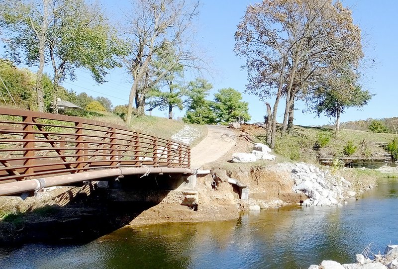 Lynn Atkins/The Weekly Vista The bridge at Scotdale hole 2 seems to be undamaged, but the creek lost a large portion of the bank during the flooding which may have undermined the approach to the bridge. If the engineers say the bridges are safe, the font nine holes of Scotsdale may reopen.