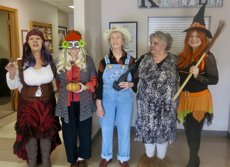 Westside Eagle Observer/SUSAN HOLLAND Entrants in the costume contest at the Billy V. Hall Senior Activity and Wellness Center's fall party line up for the camera Thursday morning, Oct. 31. Party guests voted for the winners. Pictured are Penny Leonard (left), first place winner; Connie Adams, tied for second; Freida Burnett; Melissa Williams; and Carole Robel, second.