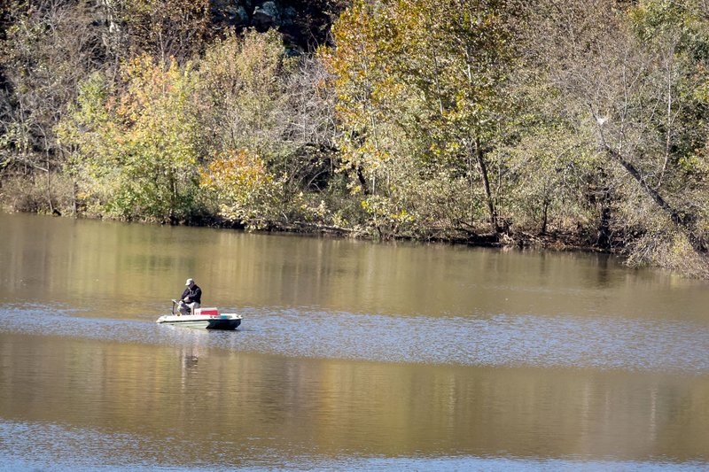 VAUGHN SKINNER SPECIAL TO ENTERPRISE-LEADER One lone person was fishing Saturday at Lincoln Lake. He said he was not having any luck and had not caught any fish. His comment was "maybe that's why no one else is here fishing."