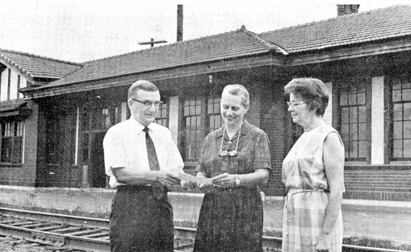 Photo submitted Don Lovelace made a presentation of $200 from the Rotary Club to Museum Society representatives Margaret Schoonover and Sabra Davis to help rebuild the old Kansas City Southern Depot for use as a museum. Exhibits in the building were opened June 20, 1971.