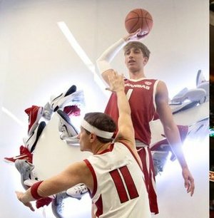 2022 guard Joseph Pinion plays the role of LeBron James while dunking on Coach Eric Musselman, who plays the role of former guard Jason Terry.