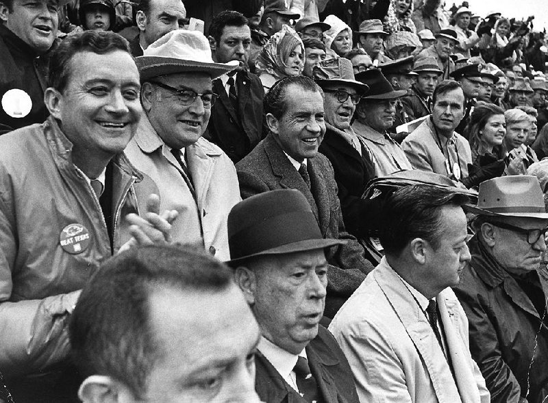 President Richard Nixon (center) watches with other dignitaries during the game between No. 1 Texas and No. 2 Arkansas at Razorback Stadium in Fayetteville on Dec. 6, 1969. Texas won 15-14. On Saturday, nearly 50 years later, President Donald Trump will attend the game in Tuscaloosa, Ala., between LSU and Alabama, the top two teams in The Associated Press poll.