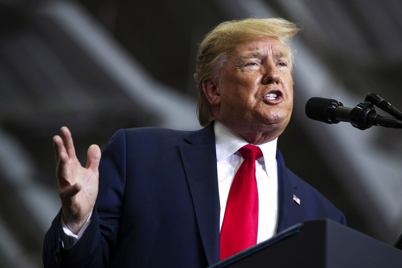 FILE - In this Nov. 6, 2019, file photo, President Donald Trump speaks during a campaign rally at the Monroe Civic Center in Monroe, La. A New York judge on Thursday, Nov. 7 ordered Trump to pay about $2 million to an array of charities to resolve a lawsuit alleging he misused his own charitable foundation to further his political and business interests. (AP Photo/Evan Vucci, File)