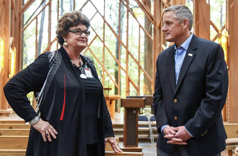 U.S. Rep. Bruce Westerman, R-District 4, talks to Peggy Clark, Fay Jones School of Architecture and Design at the University of Arkansas alumna, Thursday in Anthony Chapel at Garvan Woodland Gardens. - Photo by Grace Brown of The Sentinel-Record