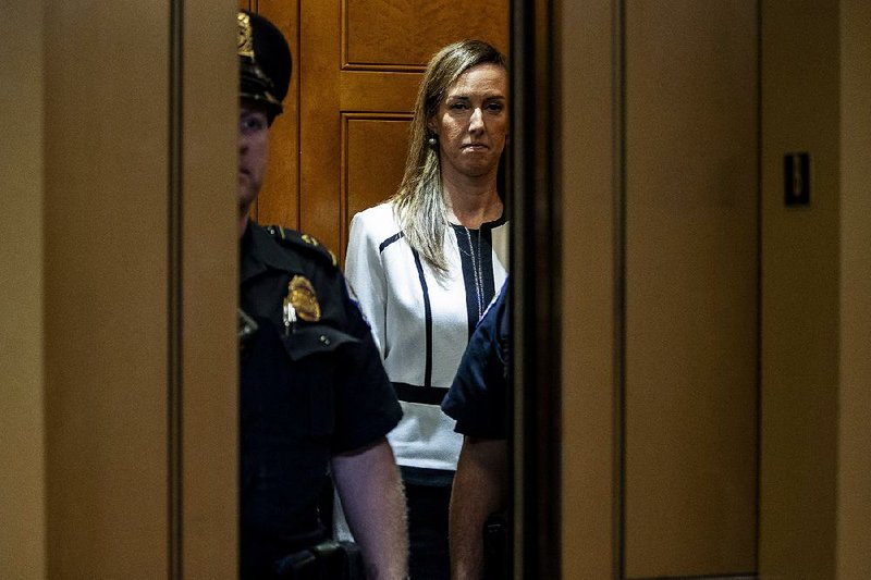 Jennifer Williams, an aide to Vice President Mike Pence, leaves the Capitol on Thursday after being questioned under subpoena for several hours by House impeachment investigators. More photos at arkansasonline.com/118aide/