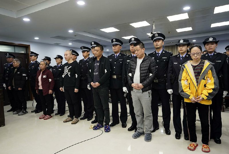 Fentanyl drug traffickers stand for sentencing Thursday in a courtroom in Xingtai in China’s northern Hebei province. More photos at arkansasonline.com/118fentanyl/ 