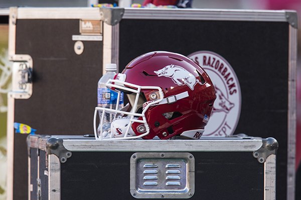 An Arkansas football helmet sits on the sideline during a game between the Razorbacks and Mississippi State on Saturday, Nov. 2, 2019, in Fayetteville. 