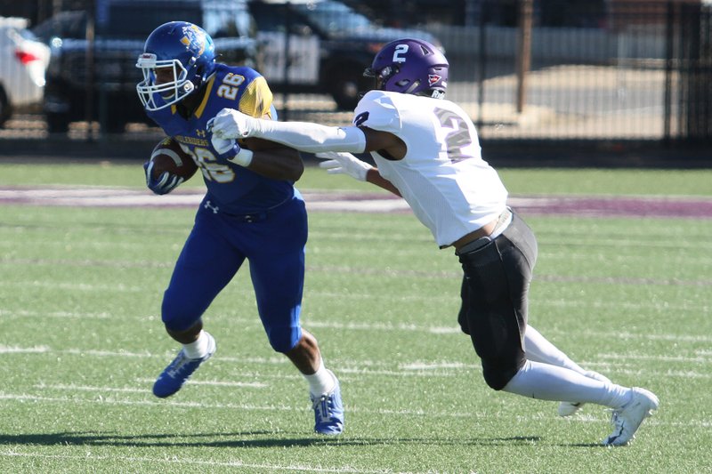 SAU runs against the OBU defense. 