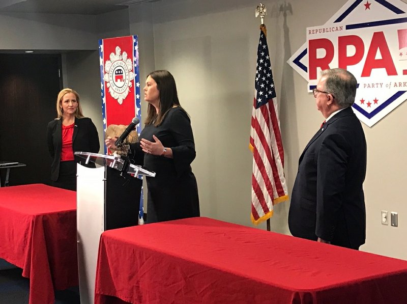 Attorney General Leslie Rutledge (left) and Sarah Huckabee Sanders (center) on Friday paid President Donald Trump’s filing fee to run for re-election in Arkansas.
