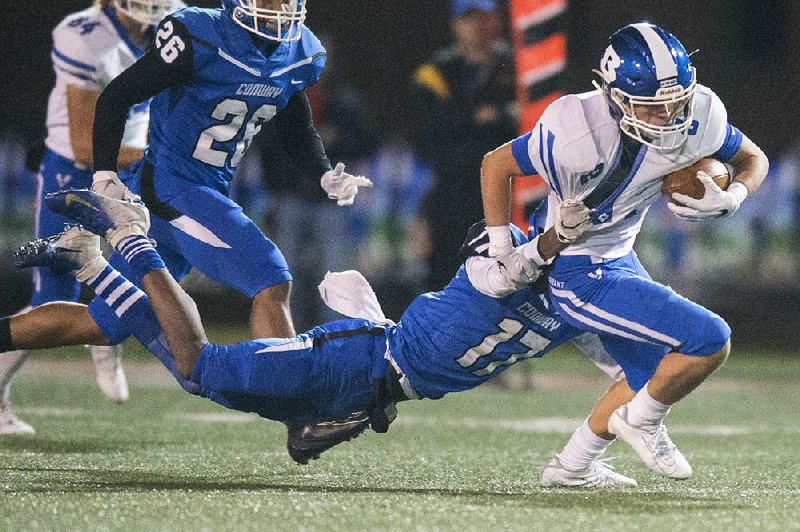 Bryant wide receiver Jake Meaders tries to get away from Conway defensive back Traland McClure during a Nov. 8 game.