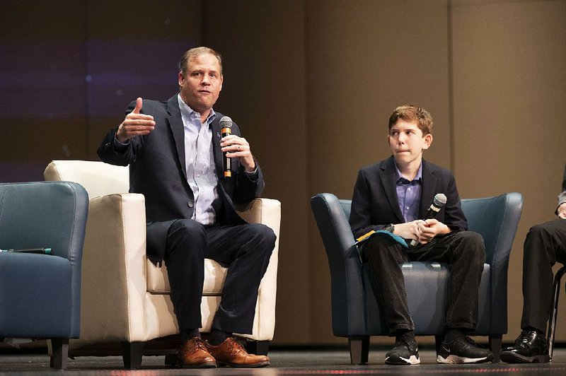 NASA Administrator Jim Bridenstine (left) talks about NASA during a question-and-answer session Friday in Bentonville, along with Ben Mattingly, a seventh grade student at Washington Junior High in Bentonville. 
