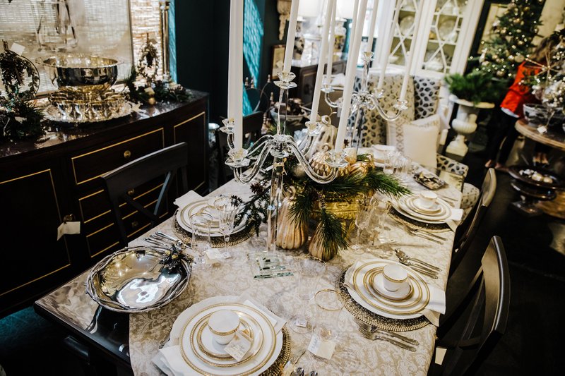 Gold-accented plate settings add elegance and glamour to a holiday tabletop. (Handout/TNS) 
