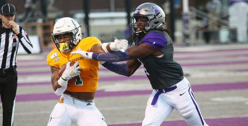 University of Central Arkansas defensive back Juan Jackson (right) tackles Southeastern Louisiana running back Devonte Williams during the Bears’ 34-0 loss to the Lions on Saturday at Estes Stadium in Conway.